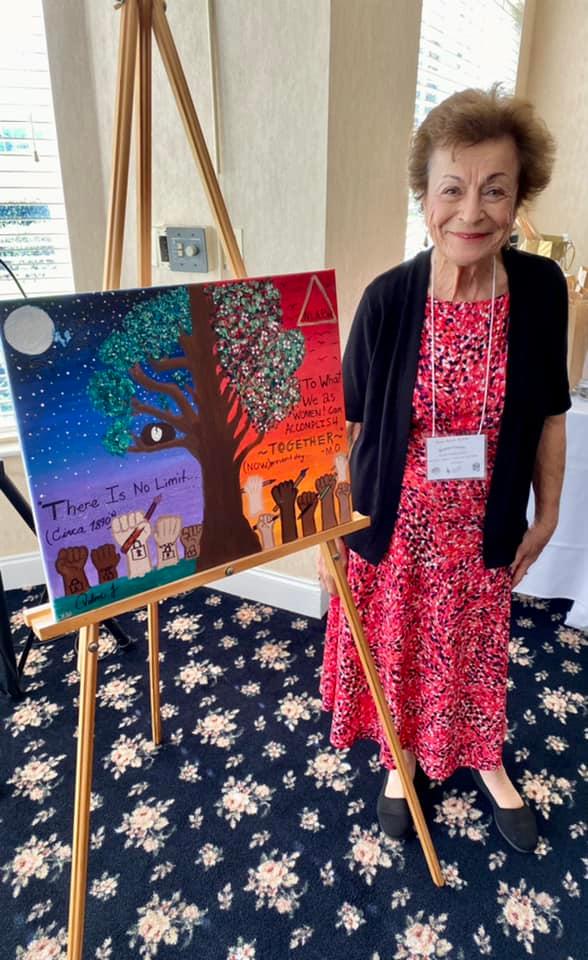 Dr. Brenda Dressler with gift painting from Milagro Teens
