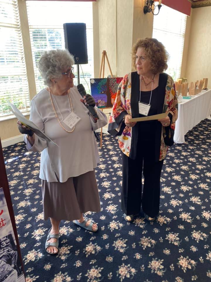 Sheila Firestone presenting member certificate to Dr. Louise Parente