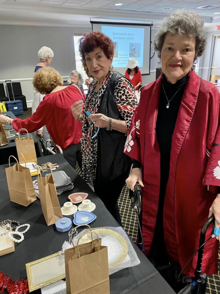 Raffle Table with Barbara Bixon (C) & Elisa Eisenman